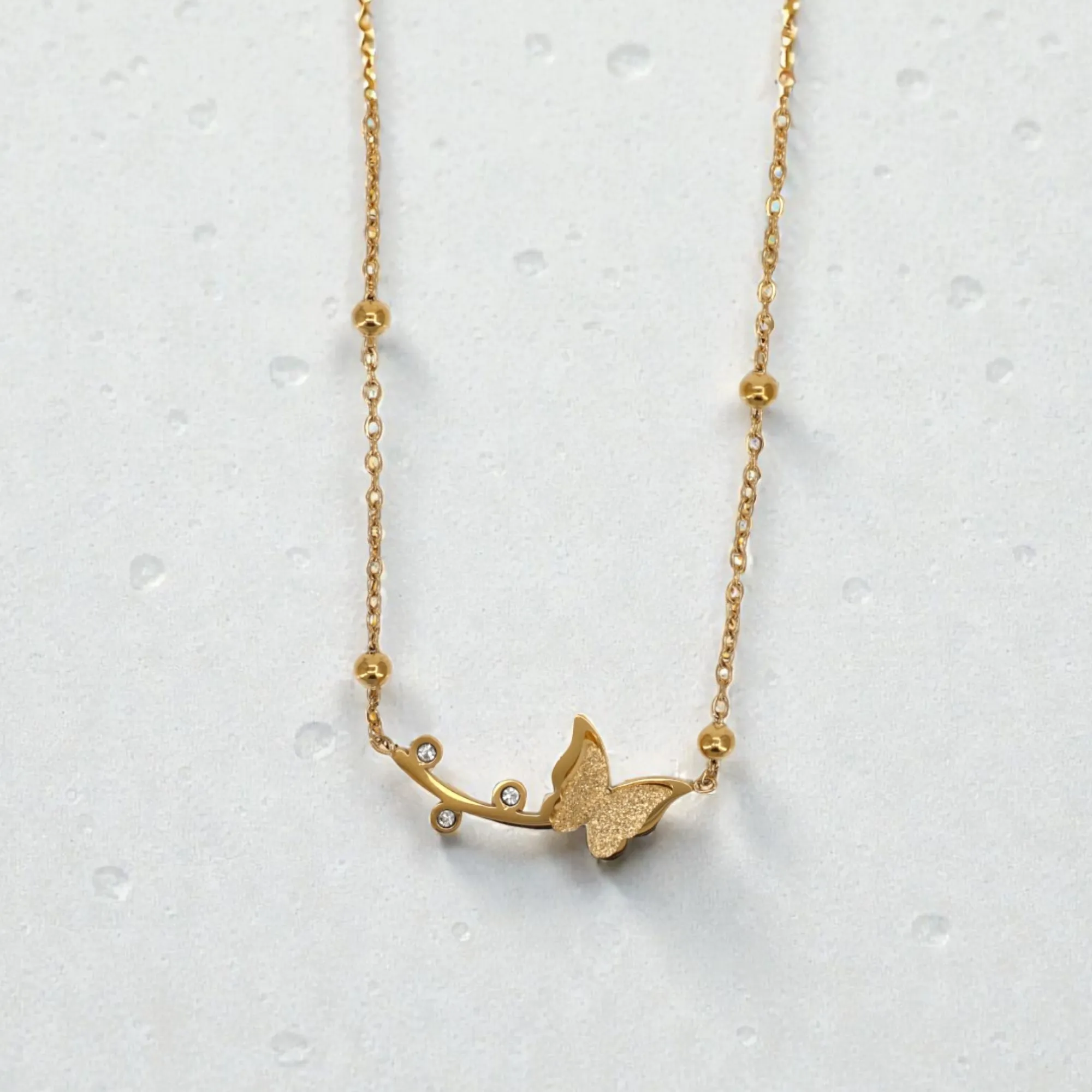 63 Rineva Butterfly Trail Gold Necklace - Image 1