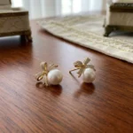 Rineva Celeste Pearl Bow Stud Earrings - Image 3