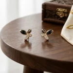 Rineva Noir Petal Luxe Gold Stud Earrings - Image 3